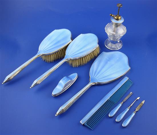 A 1930s Art Deco silver and blue guilloche enamel eight piece dressing table set,